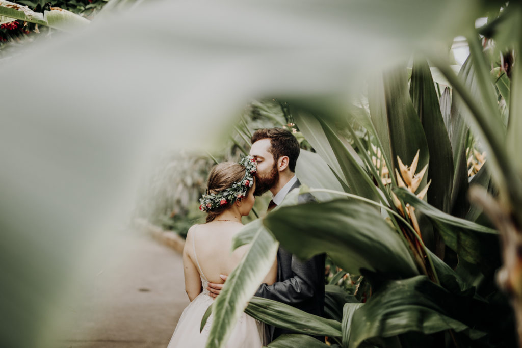 a portrait of the bride and groom at rawlings conservatory